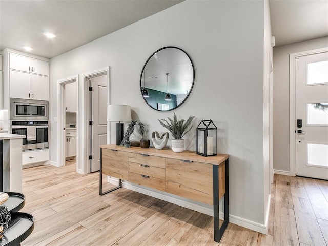 15109 Caspian Ln, Edmond, OK 73013 - entryway with light wood-style flooring and baseboards