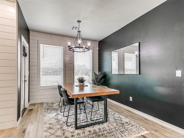 15109 Caspian Ln, Edmond, OK 73013 - dining area featuring light wood finished floors and a chandelier