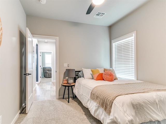 15109 Caspian Ln, Edmond, OK 73013 - bedroom featuring a ceiling fan and light colored carpet