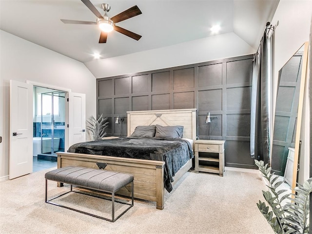 15109 Caspian Ln, Edmond, OK 73013 - carpeted bedroom featuring vaulted ceiling, ceiling fan, connected bathroom, and a decorative wall