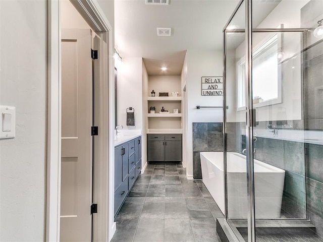 15109 Caspian Ln, Edmond, OK 73013 - full bathroom with vanity, a soaking tub, and a shower stall