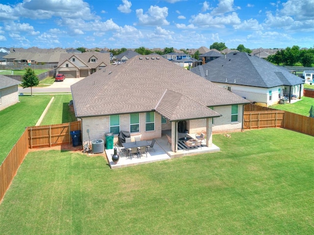 15109 Caspian Ln, Edmond, OK 73013 - rear view of house with a residential view, roof with shingles, a fenced backyard, and a patio area