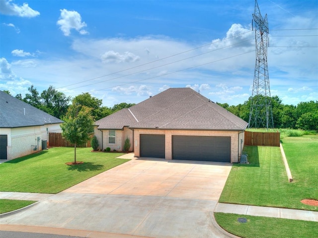 15109 Caspian Ln, Edmond, OK 73013 - french country style house with driveway, an attached garage, a shingled roof, and brick siding