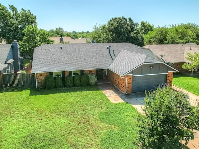 1008 S Neptune Rd, Edmond, OK 73003 - view of front of property featuring a garage, driveway, brick siding, and roof with shingles