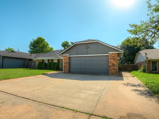 1008 S Neptune Rd, Edmond, OK 73003 - view of front facade featuring brick siding, concrete driveway, a garage, and board and batten siding