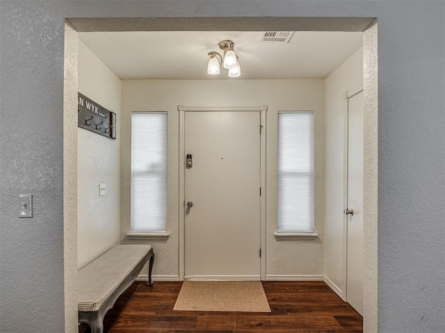 1008 S Neptune Rd, Edmond, OK 73003 - entryway with wood finished floors and a textured wall