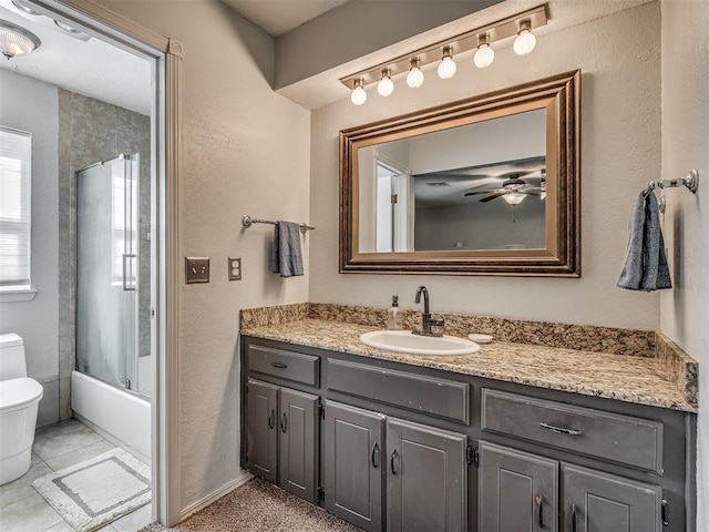 1008 S Neptune Rd, Edmond, OK 73003 - full bath with vanity, a ceiling fan, tub / shower combination, and tile patterned floors