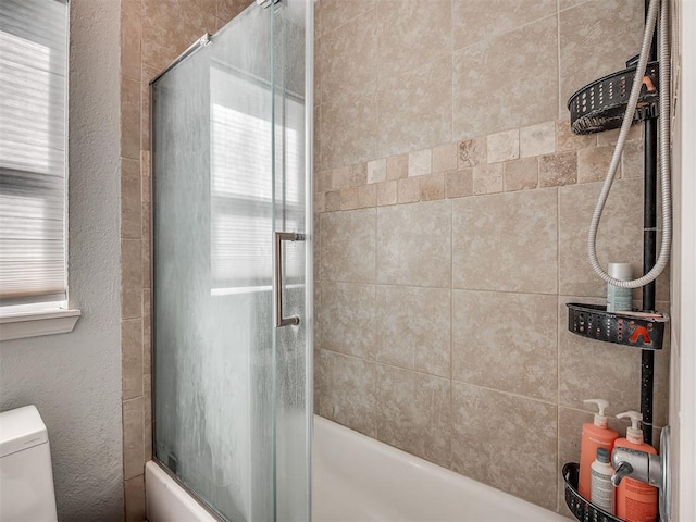1008 S Neptune Rd, Edmond, OK 73003 - bathroom featuring enclosed tub / shower combo and healthy amount of natural light