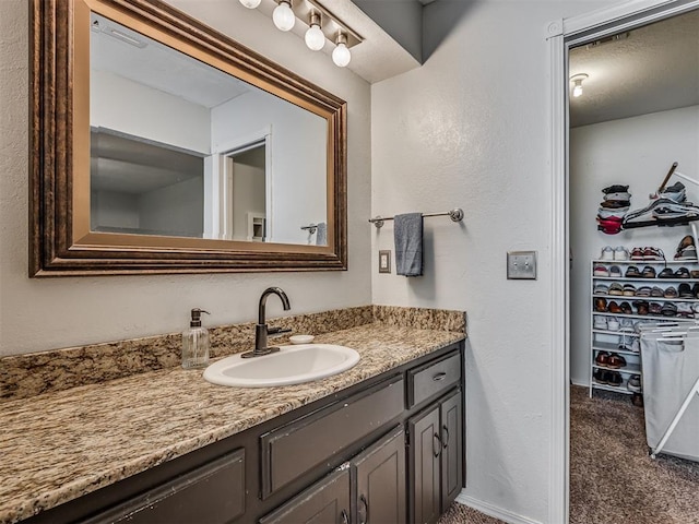 1008 S Neptune Rd, Edmond, OK 73003 - bathroom with vanity and baseboards