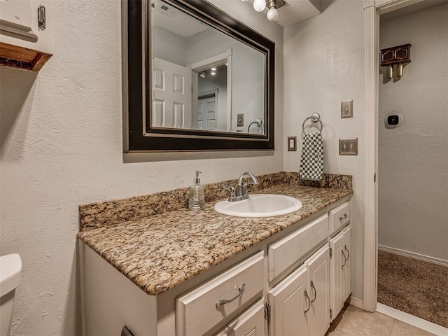 1008 S Neptune Rd, Edmond, OK 73003 - bathroom featuring vanity and tile patterned floors