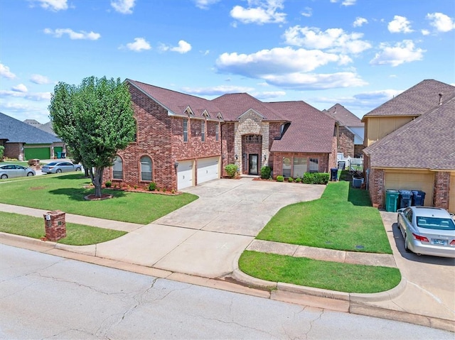 125 NW 147th St, Edmond, OK 73013 - view of front of property with driveway, brick siding, a front yard, and a garage