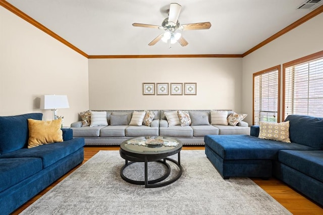 125 NW 147th St, Edmond, OK 73013 - living area featuring wood finished floors, ornamental molding, and a ceiling fan