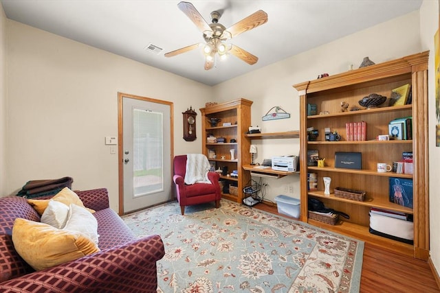 125 NW 147th St, Edmond, OK 73013 - living area with wood finished floors and a ceiling fan