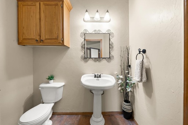 125 NW 147th St, Edmond, OK 73013 - half bathroom featuring toilet and baseboards
