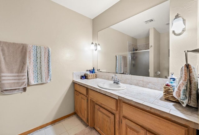 125 NW 147th St, Edmond, OK 73013 - bathroom with vanity, a shower stall, and tile patterned flooring