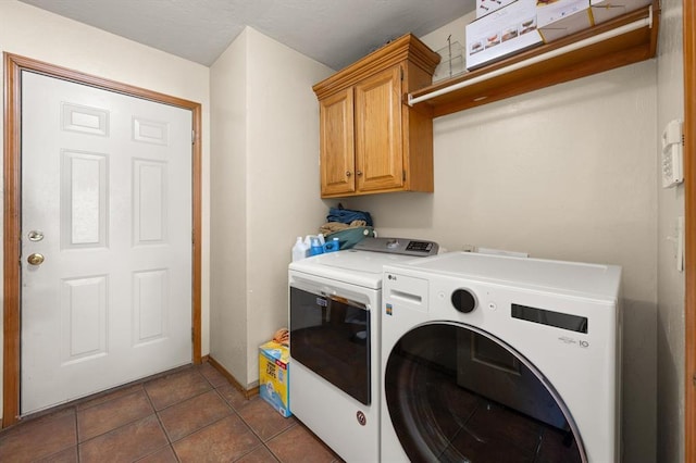 125 NW 147th St, Edmond, OK 73013 - laundry room featuring washer and dryer, cabinet space, and dark tile patterned floors
