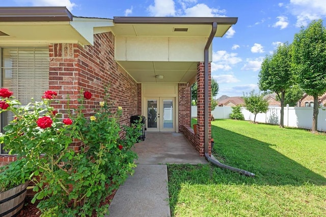 125 NW 147th St, Edmond, OK 73013 - entrance to property with french doors and brick siding