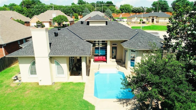 1004 Reginald Dr, Norman, OK 73072 - rear view of house with a shingled roof, stucco siding, a chimney, a residential view, and a patio