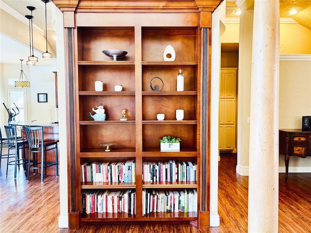 1004 Reginald Dr, Norman, OK 73072 - detailed view of decorative columns, wood finished floors, ornamental molding, and a textured wall
