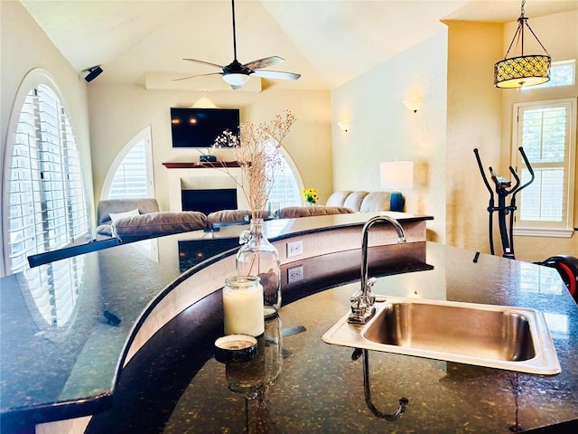 1004 Reginald Dr, Norman, OK 73072 - living area featuring a ceiling fan, healthy amount of natural light, and vaulted ceiling