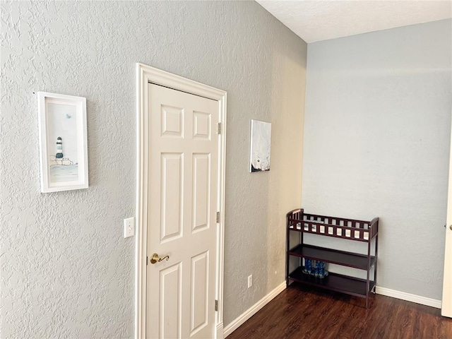 1004 Reginald Dr, Norman, OK 73072 - hallway featuring wood finished floors and a textured wall
