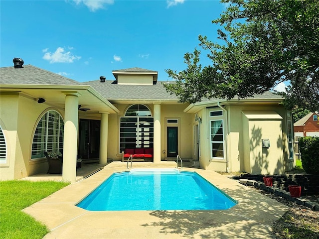 1004 Reginald Dr, Norman, OK 73072 - rear view of house featuring a patio area, stucco siding, and an outdoor pool