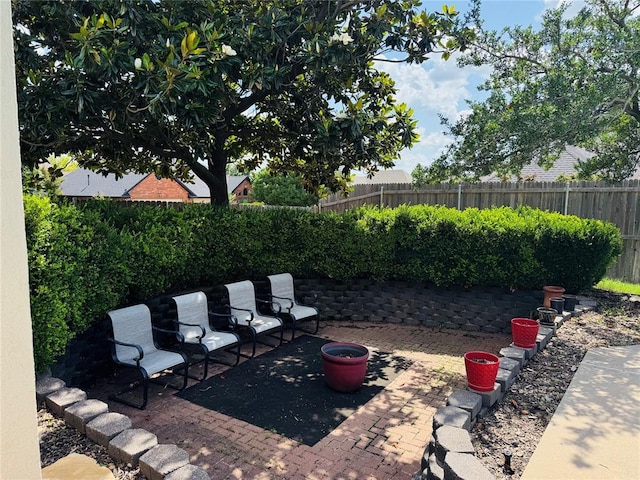 1004 Reginald Dr, Norman, OK 73072 - fenced backyard with a patio area