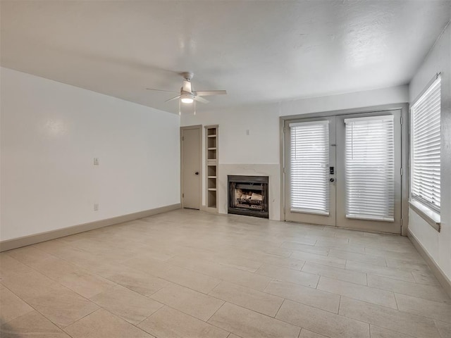 11550 N May Ave Unit 108, Oklahoma City, OK 73120 - unfurnished living room featuring plenty of natural light, a ceiling fan, a fireplace, and french doors