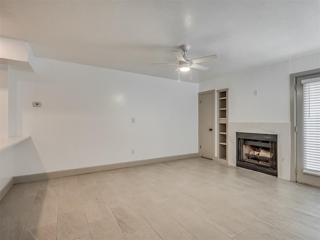 11550 N May Ave Unit 108, Oklahoma City, OK 73120 - unfurnished living room featuring ceiling fan and a fireplace