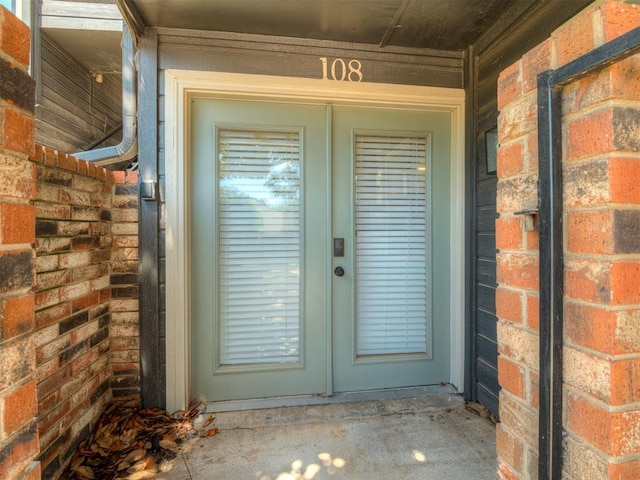 11550 N May Ave Unit 108, Oklahoma City, OK 73120 - view of exterior entry with french doors