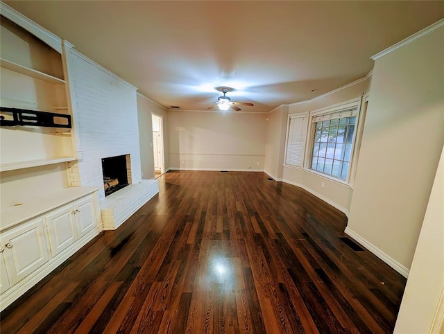2436 NW 43rd Cir, Oklahoma City, OK 73112 - unfurnished living room featuring ceiling fan, dark wood finished floors, ornamental molding, and a fireplace