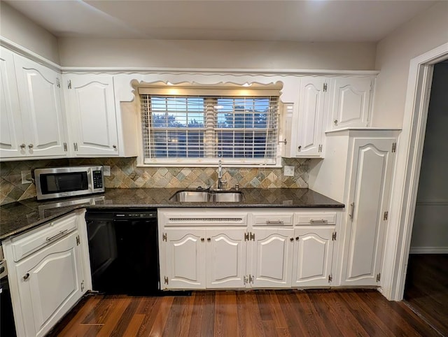 2436 NW 43rd Cir, Oklahoma City, OK 73112 - kitchen with dishwasher, stainless steel microwave, dark wood finished floors, white cabinetry, and decorative backsplash