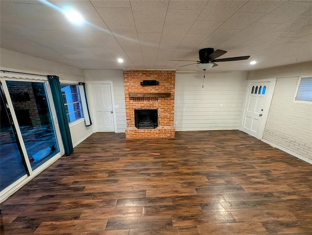 2436 NW 43rd Cir, Oklahoma City, OK 73112 - unfurnished living room featuring wood finished floors, ceiling fan, a fireplace, and recessed lighting