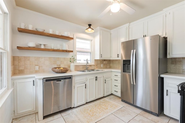 2204 Churchill Pl, Oklahoma City, OK 73120 - kitchen with appliances with stainless steel finishes, decorative backsplash, light tile patterned flooring, and light countertops
