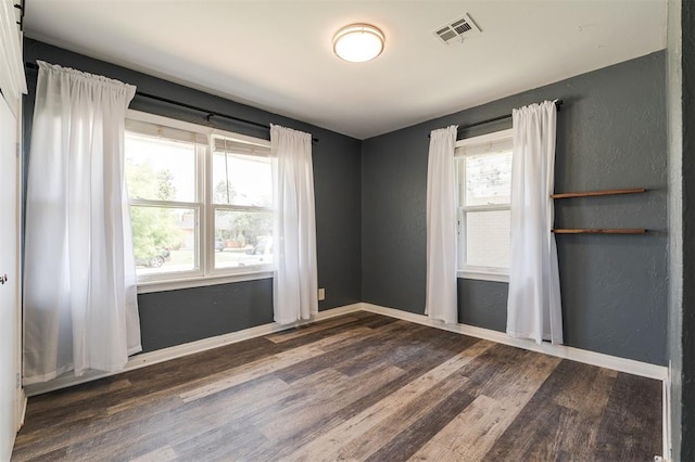 2204 Churchill Pl, Oklahoma City, OK 73120 - unfurnished room featuring dark wood finished floors and a textured wall