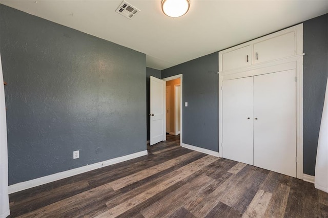 2204 Churchill Pl, Oklahoma City, OK 73120 - unfurnished bedroom with wood finished floors and a closet