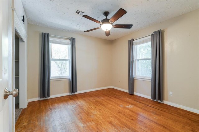 2204 Churchill Pl, Oklahoma City, OK 73120 - spare room featuring light wood-type flooring, a ceiling fan, and a textured ceiling
