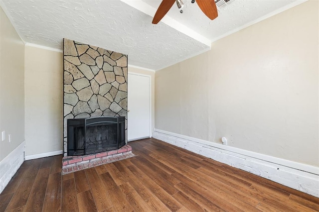 2204 Churchill Pl, Oklahoma City, OK 73120 - unfurnished living room with ceiling fan, wood finished floors, a textured ceiling, a fireplace, and ornamental molding