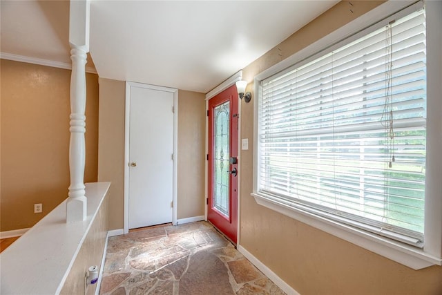 824 N Poplar Ln, Midwest City, OK 73130 - foyer entrance featuring stone finish floors and baseboards