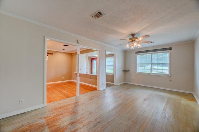 824 N Poplar Ln, Midwest City, OK 73130 - empty room with wood finished floors, ceiling fan, and crown molding