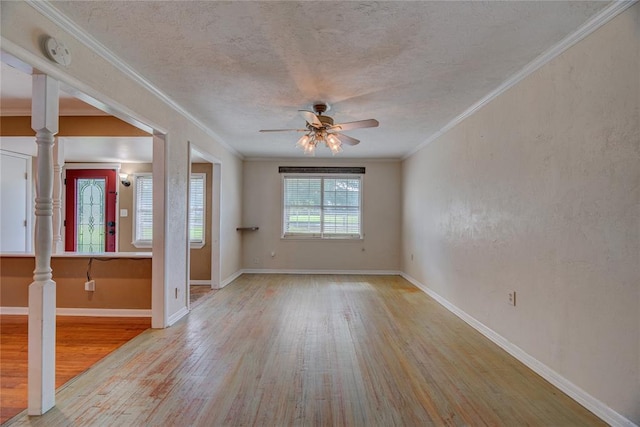 824 N Poplar Ln, Midwest City, OK 73130 - empty room featuring wood finished floors, a ceiling fan, a smoke detector, a textured ceiling, and ornamental molding