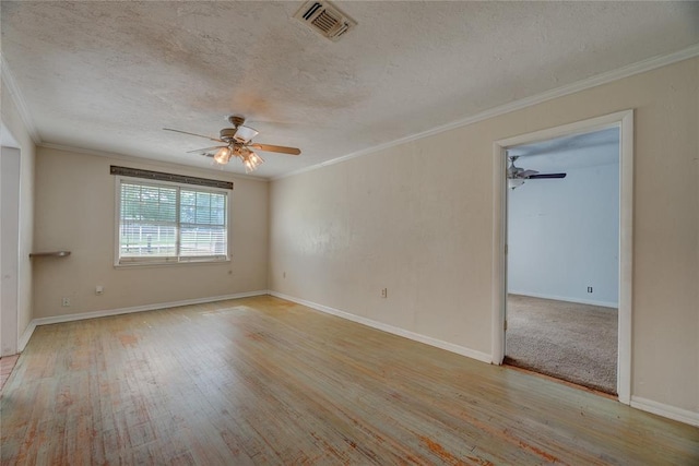 824 N Poplar Ln, Midwest City, OK 73130 - empty room with a ceiling fan, a textured ceiling, crown molding, and wood finished floors