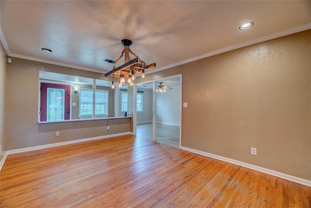 824 N Poplar Ln, Midwest City, OK 73130 - spare room with wood finished floors, ornamental molding, and recessed lighting