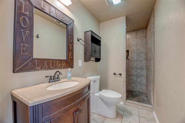 824 N Poplar Ln, Midwest City, OK 73130 - bathroom with vanity, a tile shower, and tile patterned flooring