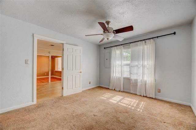 824 N Poplar Ln, Midwest City, OK 73130 - unfurnished bedroom with carpet flooring, a textured ceiling, and ceiling fan