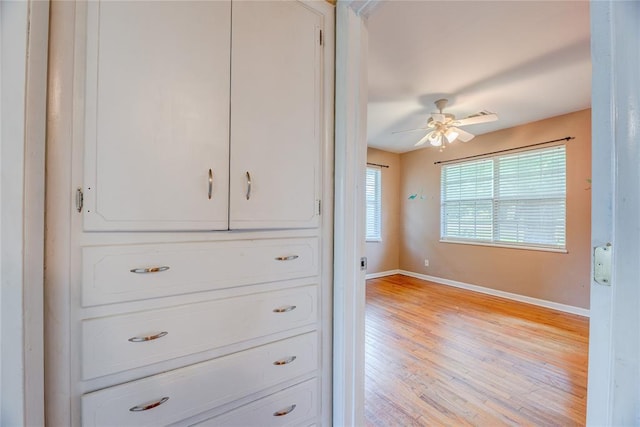 824 N Poplar Ln, Midwest City, OK 73130 - detailed view of a ceiling fan and wood finished floors