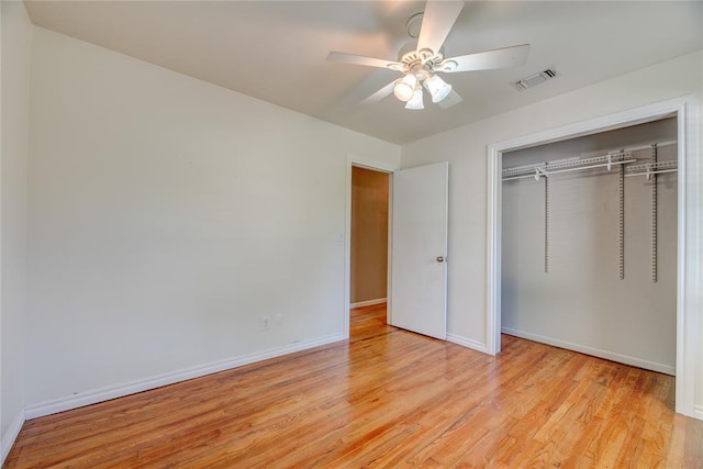 824 N Poplar Ln, Midwest City, OK 73130 - unfurnished bedroom featuring a closet, light wood-style floors, and ceiling fan