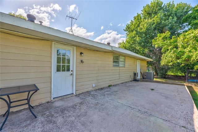 824 N Poplar Ln, Midwest City, OK 73130 - view of home's exterior featuring a patio and a central AC unit