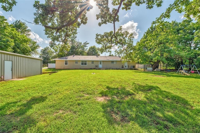 824 N Poplar Ln, Midwest City, OK 73130 - view of yard with a playground