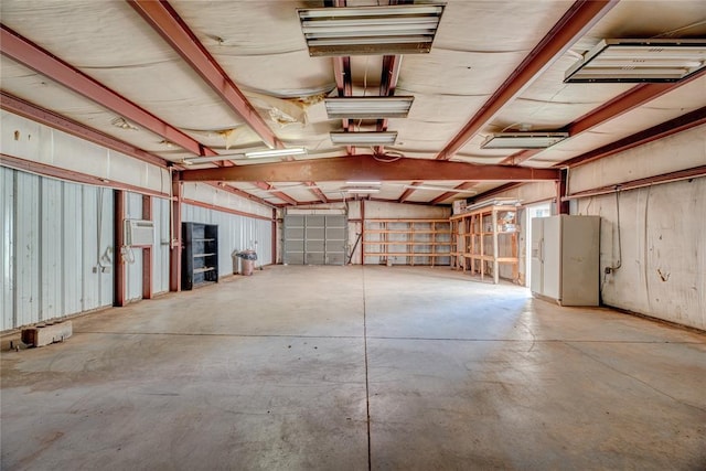 824 N Poplar Ln, Midwest City, OK 73130 - garage featuring white fridge with ice dispenser and a wall mounted air conditioner